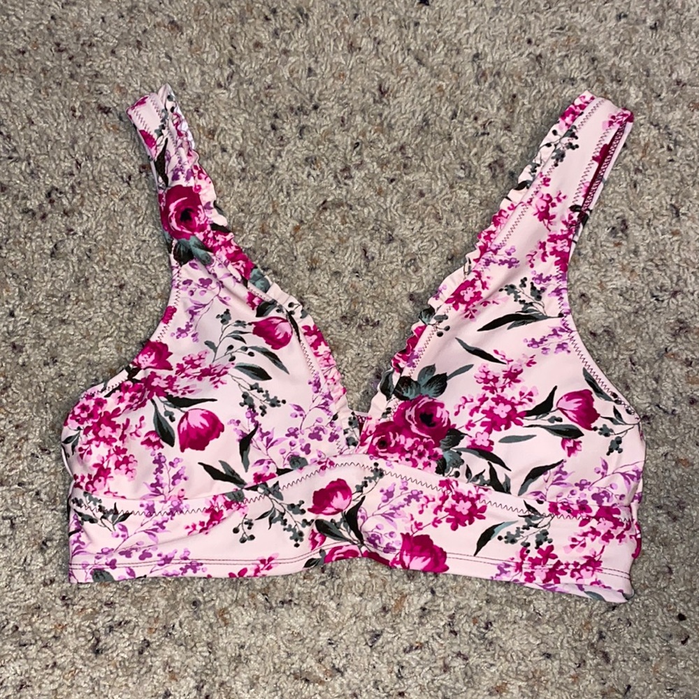 Light pink bikini top. Thick straps and band. Floral design. Ruffles.